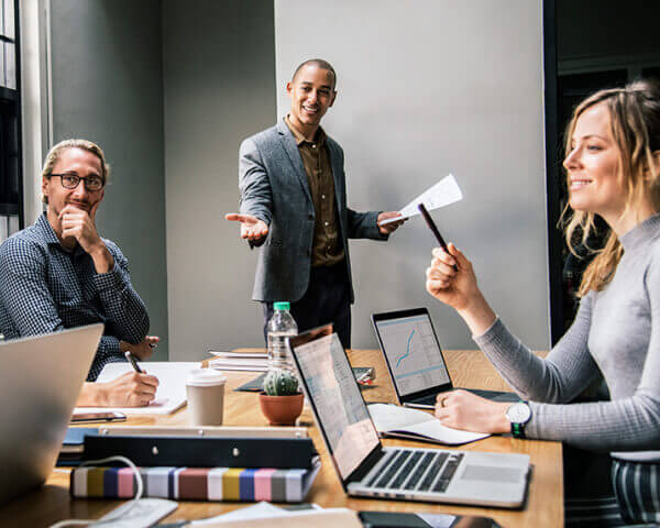 Team collaborating in a modern office meeting, representing focus and partnership.
